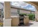 Covered patio with built in grill provides a great space for outdoor cooking at 26017 W Maple Dr, Buckeye, AZ 85396