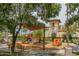 Community playground with shade, seating, and a charming play car, perfect for Gathering fun at 26017 W Maple Dr, Buckeye, AZ 85396