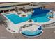 Stunning community pool area with multiple pools, cabanas, a hot tub, and plenty of lounge chairs for relaxing at 26017 W Maple Dr, Buckeye, AZ 85396