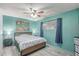 Cozy bedroom with a ceiling fan, wood-style flooring, and soft decor at 2700 E Allred Ave # R87, Mesa, AZ 85204