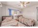 Bedroom with twin beds, patterned bedding, and soft decor at 2700 E Allred Ave # R87, Mesa, AZ 85204