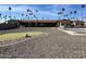 Community recreation area with shuffleboard, putting green and building at 2700 E Allred Ave # R87, Mesa, AZ 85204