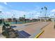 Enjoy community features such as bocce ball, benches and manicured landscaping under a bright blue sky at 2700 E Allred Ave # R87, Mesa, AZ 85204