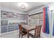 Dining room with built-in storage and bright windows for natural lighting at 2700 E Allred Ave # R87, Mesa, AZ 85204