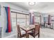 Sunlit dining room features comfortable seating and natural light at 2700 E Allred Ave # R87, Mesa, AZ 85204