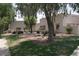 Charming single-Gathering house boasts a well-maintained landscape, mature trees, and ample curb appeal at 2700 E Allred Ave # R87, Mesa, AZ 85204