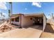 Exterior view of a single-story home with covered parking and mature landscaping at 2700 E Allred Ave # R87, Mesa, AZ 85204
