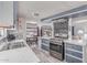 Well-lit kitchen with stainless steel appliances, adjacent dining area, and modern finishes at 2700 E Allred Ave # R87, Mesa, AZ 85204