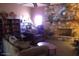 Cozy living room features a stone fireplace, built-in bookshelves, and comfortable seating at 2700 E Allred Ave # R87, Mesa, AZ 85204
