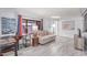 Cozy living room with a comfortable sofa, wood-style flooring, and bright windows at 2700 E Allred Ave # R87, Mesa, AZ 85204