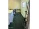 Long storage space with lots of shelving and a washer and dryer at 2700 E Allred Ave # R87, Mesa, AZ 85204