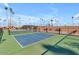 Well-maintained tennis court offers a recreational space for friendly matches amidst lush green surroundings at 2700 E Allred Ave # R87, Mesa, AZ 85204