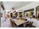 Covered patio with an outdoor dining area and outdoor kitchen at 3209 E Fox St, Mesa, AZ 85213
