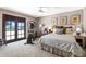 Bedroom featuring an elliptical machine and an en-suite bathroom at 3209 E Fox St, Mesa, AZ 85213