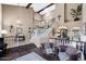 Spacious foyer with a grand staircase, elegant chandeliers, and an open layout to the living areas at 3209 E Fox St, Mesa, AZ 85213