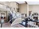 Grand foyer featuring a dramatic staircase, soaring ceilings, and views into the elegant living spaces at 3209 E Fox St, Mesa, AZ 85213