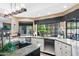 Modern kitchen with granite countertops and stainless steel appliances at 3209 E Fox St, Mesa, AZ 85213