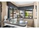 Breakfast bar with granite countertop near the kitchen windows at 3209 E Fox St, Mesa, AZ 85213