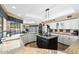 Spacious kitchen with granite countertops, central island, and stainless appliances at 3209 E Fox St, Mesa, AZ 85213