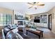 Inviting living room with a fireplace, built-in shelving, and comfortable seating for a relaxing atmosphere at 3209 E Fox St, Mesa, AZ 85213
