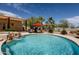 Outdoor backyard features a custom pool with a rock waterfall and mature desert landscaping at 37809 N 9Th Pl, Phoenix, AZ 85086