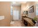 Granite countertops and a modern vessel sink highlight this stylish bathroom, alongside a large walk-in shower at 37809 N 9Th Pl, Phoenix, AZ 85086
