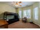 bedroom with bunk beds, ceiling fan and bright windows at 37809 N 9Th Pl, Phoenix, AZ 85086
