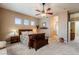 Spacious bedroom with neutral walls, carpet and a view to the bathroom through an arched doorway at 37809 N 9Th Pl, Phoenix, AZ 85086