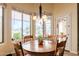 Bright dining area with natural light, pool view, and access to outdoor living space at 37809 N 9Th Pl, Phoenix, AZ 85086