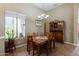Dining room featuring a chandelier and window with neighborhood views at 37809 N 9Th Pl, Phoenix, AZ 85086