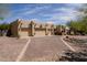Exterior elevation showcases the home's three car garage and desert landscaping at 37809 N 9Th Pl, Phoenix, AZ 85086