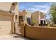 Exterior view of the home's gated entry and front courtyard with desert landscaping at 37809 N 9Th Pl, Phoenix, AZ 85086