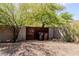 Metal gate surrounded by a block wall with foliage and trash receptacles nearby at 37809 N 9Th Pl, Phoenix, AZ 85086