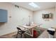 Bright hobby room features a dart board, large table for projects, and wood-look flooring at 37809 N 9Th Pl, Phoenix, AZ 85086