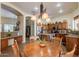 Kitchen and dining area with wooden floors, access to the living room, and lots of natural light at 37809 N 9Th Pl, Phoenix, AZ 85086