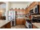 Functional kitchen featuring stainless steel appliances, granite countertops, and abundant storage at 37809 N 9Th Pl, Phoenix, AZ 85086