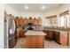 Well-equipped kitchen features stainless steel appliances, granite countertops, and ample cabinet space at 37809 N 9Th Pl, Phoenix, AZ 85086
