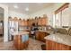 Spacious kitchen with stainless steel appliances, granite countertops, and stylish tile backsplash at 37809 N 9Th Pl, Phoenix, AZ 85086