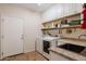 Laundry room with sink, washer, dryer, and storage shelving at 37809 N 9Th Pl, Phoenix, AZ 85086