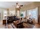 Bright living room with tile floors, large windows, and neutral decor, offering a relaxing atmosphere at 37809 N 9Th Pl, Phoenix, AZ 85086