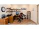 Charming office space with built-in shelves, wood floors, an executive desk and chair at 37809 N 9Th Pl, Phoenix, AZ 85086