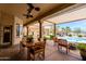 Covered patio with outdoor seating and view of the pool area at 37809 N 9Th Pl, Phoenix, AZ 85086