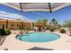 Beautiful pool featuring a rock waterfall and poolside lounge area for ultimate relaxation at 37809 N 9Th Pl, Phoenix, AZ 85086