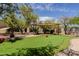 Backyard putting green with multiple holes and a covered seating area at 37809 N 9Th Pl, Phoenix, AZ 85086