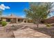 Private backyard boasts desert landscaping, covered patio, and stone pavers, perfect for relaxation and outdoor entertaining at 41202 N Rolling Green Way, Anthem, AZ 85086