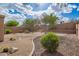 Expansive backyard featuring desert landscaping, stone accents, and lush greenery, ideal for enjoying the natural surroundings at 41202 N Rolling Green Way, Anthem, AZ 85086