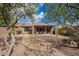 Backyard patio and desert landscaping, perfect for outdoor entertaining and relaxation at 41202 N Rolling Green Way, Anthem, AZ 85086