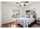 Comfortable bedroom featuring a queen bed and a view of the outdoor scenery at 41202 N Rolling Green Way, Anthem, AZ 85086