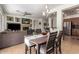 Open concept living and dining area with backyard views at 41202 N Rolling Green Way, Anthem, AZ 85086