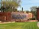 Elegant Anthem by Del Webb community entrance sign with brick accents, landscaping, and a welcoming atmosphere at 41202 N Rolling Green Way, Anthem, AZ 85086